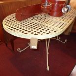 A white painted wrought iron garden table
