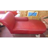 A red leather contemporary chaise lounge