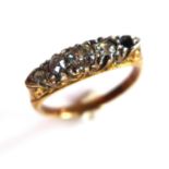 A ladies yellow metal ring, inset with four round cut diamonds (one missing), size J 1/2
