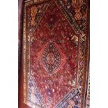 An extrmeley fine South West Persian Qashqai carpet, central diamond medallion on a terracotta field