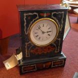 A 19th century French ebonised mantel clock, having Roman enamel dial, chiming gong, the plain
