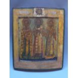 A Russian icon depicting three saints, with Jesus christ above in the polya, tempera on wood