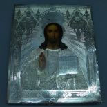 A Russian icon, Christ Pantokrator, tempera on wood panel with silver oklad, hallmarked, 27 x 22cm