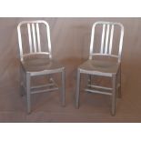 A pair of contemporary brushed aluminium Emeco navy chairs