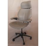 A Humanscale Freedom grey leather desk chair