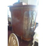 A large French Empire kingwood credenza, circa 1900, central door flanked by two bowed bevelled