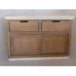 A Roche Bobois sideboard, with two small drawers above slide doors, having ivory coloured top, H.