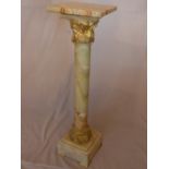 A Corinthian column onyx and ormolu pedestal, H.110cm