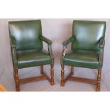 A Howard & Sons oak Gainsborough chair, with green leather stud bound upholstery, raised on turned