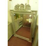 A contemporary silver painted wall mirror, with bevelled glass plate within beaded border, having