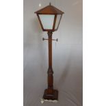 A 1940's carved oak standard lamp, in the form of a street lamp, H.182cm