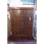 A 20th century Chinese hardwood apothecary chest, with 35 drawers, raised on shaped base, H.175 W.