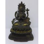 A 19th century Tibetan bronze deity, seated on lotus base, H.26cm