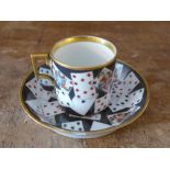 A Vienna card pattern porcelain cup and saucer