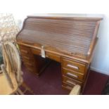 An early 20th century roll top bureau