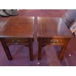 A Georgian style mahogany coffee table, with two drawers, together with a pair of matching lamp