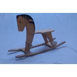 A vintage oak rocking horse