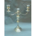 A silver plated two branch candelabra, by G.A. Baker, H.33cm