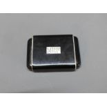 A Cartier Art Deco silver and onyx purse watch, monogrammed M.R.F