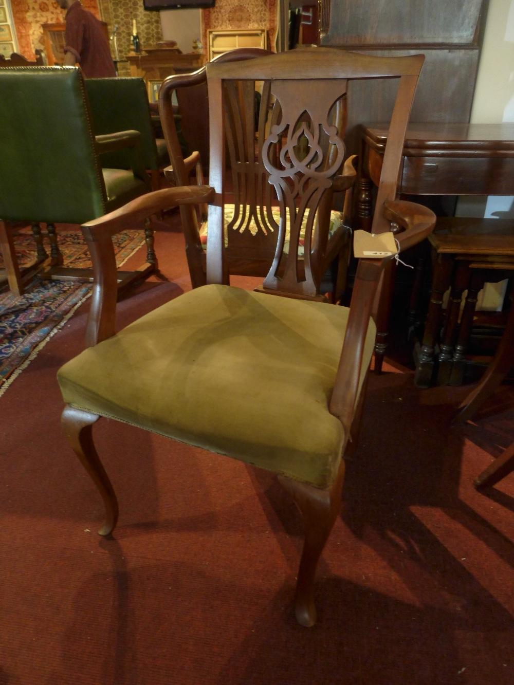 A Georgian style mahogany armchair, raised on cabriole legs