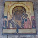 A Russian icon, The Mother of God of Kazan, flanked by saints to the polya, tempera on wood panel,