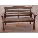 A 20th century weather teak garden bench