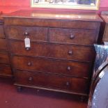 A Victorian flame mahogany chest, with two short over three long drawers, raised on bun feet, H.