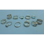 A collection of eleven silver and white metal rings, to include a silver ring with inset amethyst,