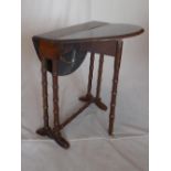 A late 19th century mahogany Sutherland table, raised on turned legs and castors