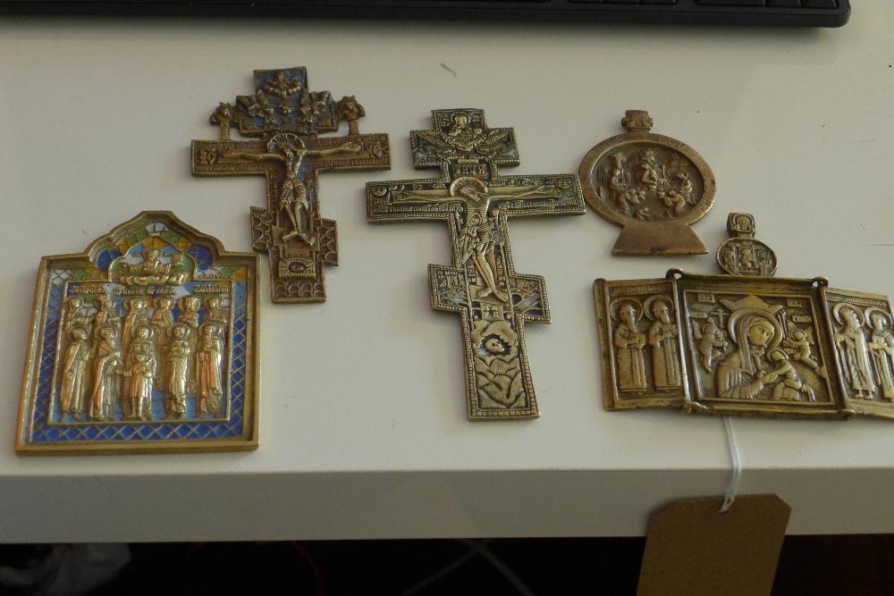 A collection of Russian brass icons, to include a brass and enamel crucifix, a larger brass