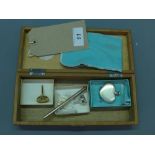 A Tiffany & Co silver ballpoint pen, a Tiffany & Co. heart shaped scent bottle with dust bag and