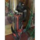 A Wilson golf bag, with Trilogy by John Letters golf clubs