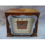 An Art Deco Enfield oak mantel clock, square Arabic dial, raised on bracket feet, H.14 W.18cm