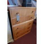 A mid 20th century G-plan oak chest, with five drawers, raised on plinth base, H.105 W.76 D.47cm
