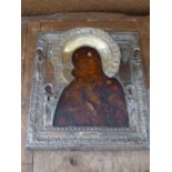 A Russian icon, The Vladimirskaya Mother of God, tempera on wood panel with silver oklad having