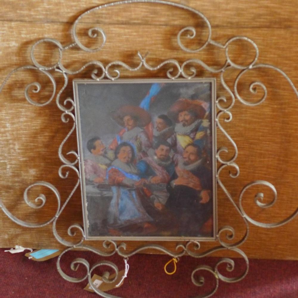 An early 20th century Dutch pub sign, with glass panel depicting soldiers, within scrolling cast
