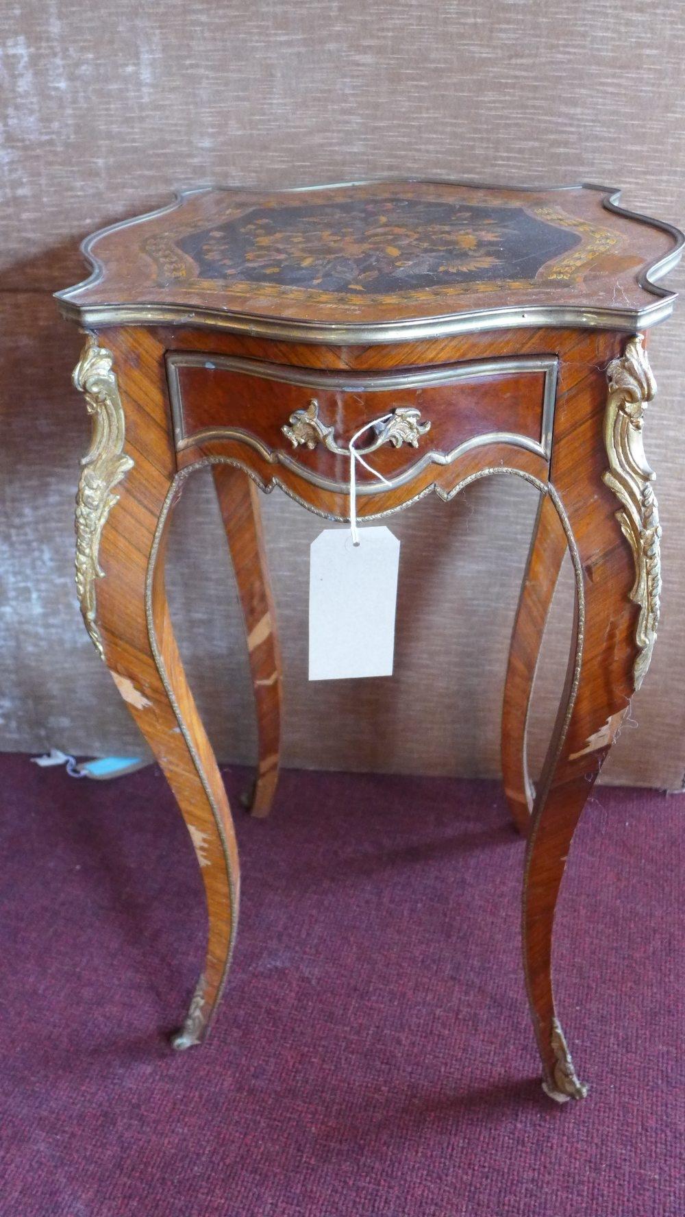 An early 20th century Louis XV style walnut lamp table, with marquetry inlay, having ormolu