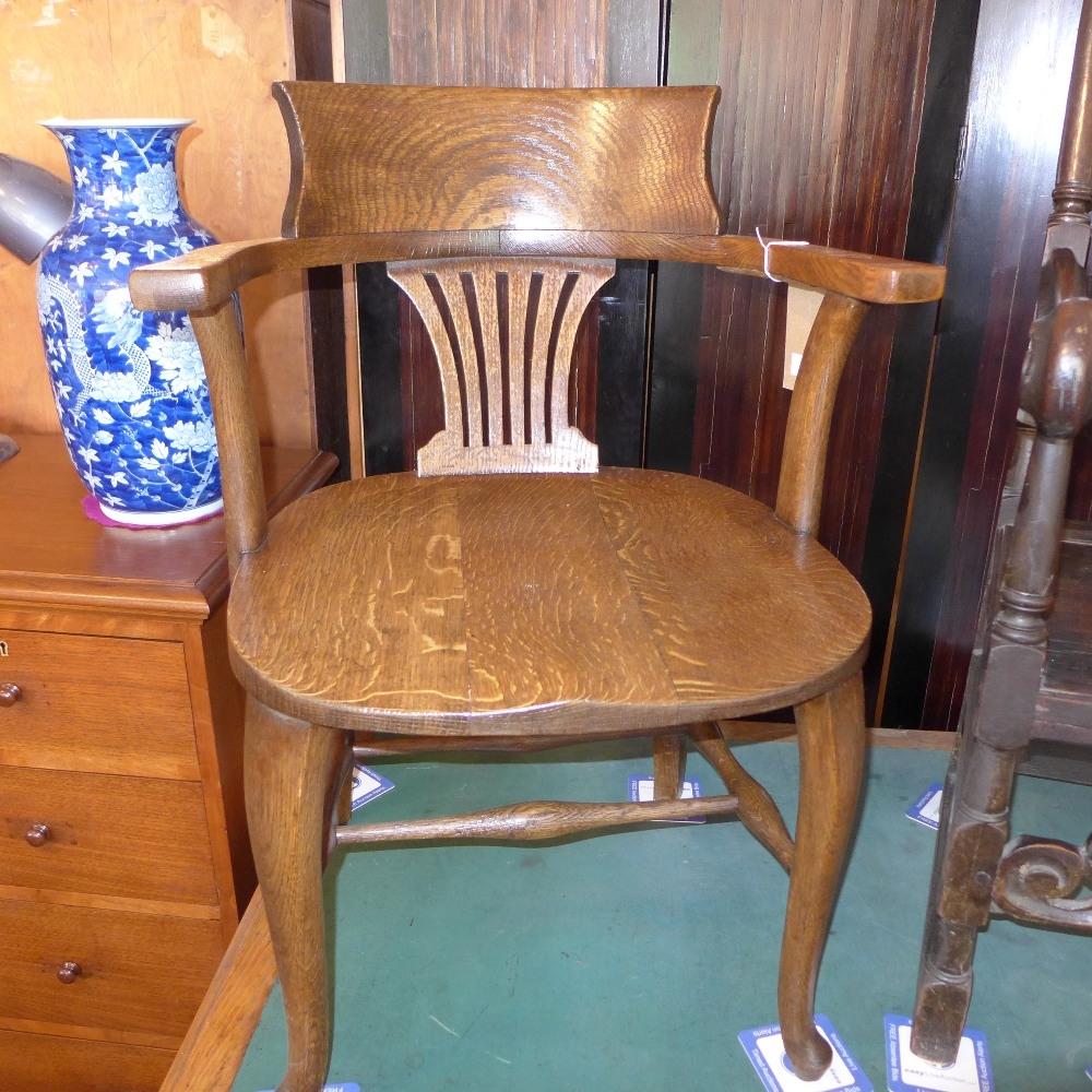 An early 20th century oak desk chair