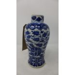 A late 19th century Chinese blue and white porcelain vase, with floral design, bears four
