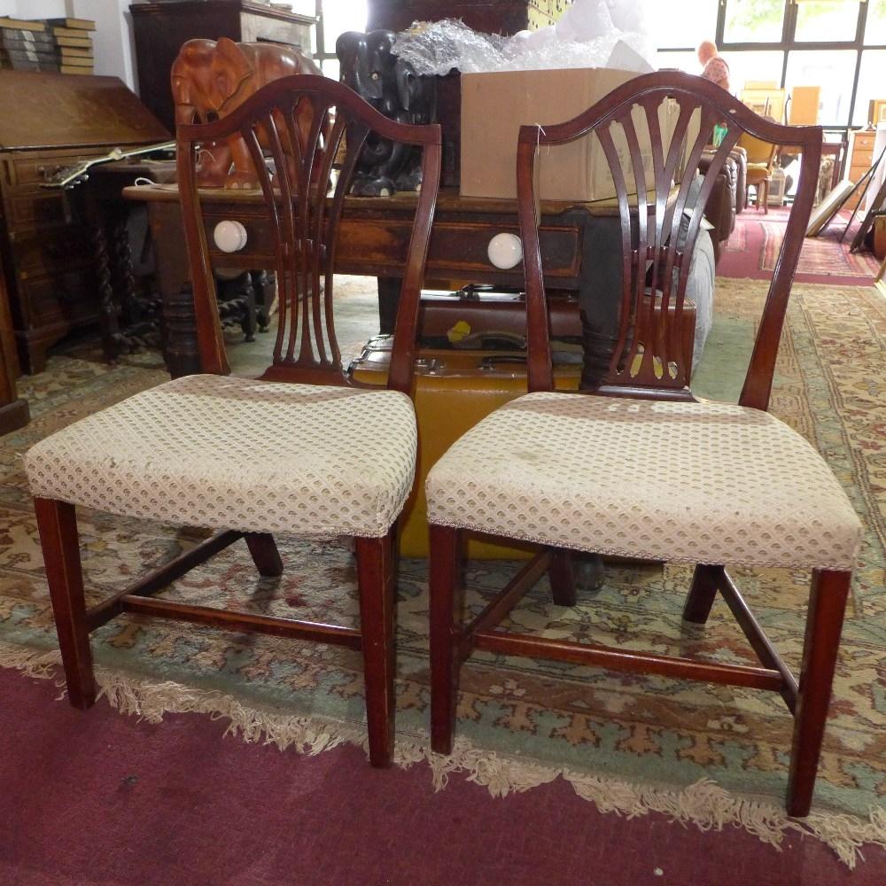 A pair of early 20th century Hepplewhite style mahogany dining chairs with cream upholstery