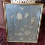 A Chinese silk embroidery depicting stylised flowers, framed and glazed, 42 x 35.5cm