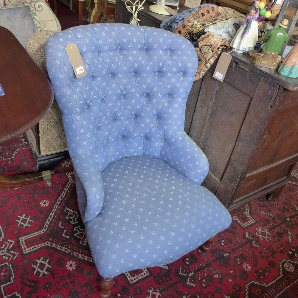 A Victorian style spoon back armchair, with blue floral button back upholstery, raised on turned - Image 2 of 2