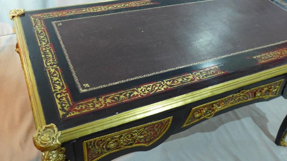 A Louis XV style ebonized boulle desk, having leather top, ormolu mounts, three drawers, raised on - Image 4 of 6