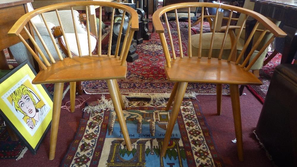 A pair of Conant Ball maple armchairs