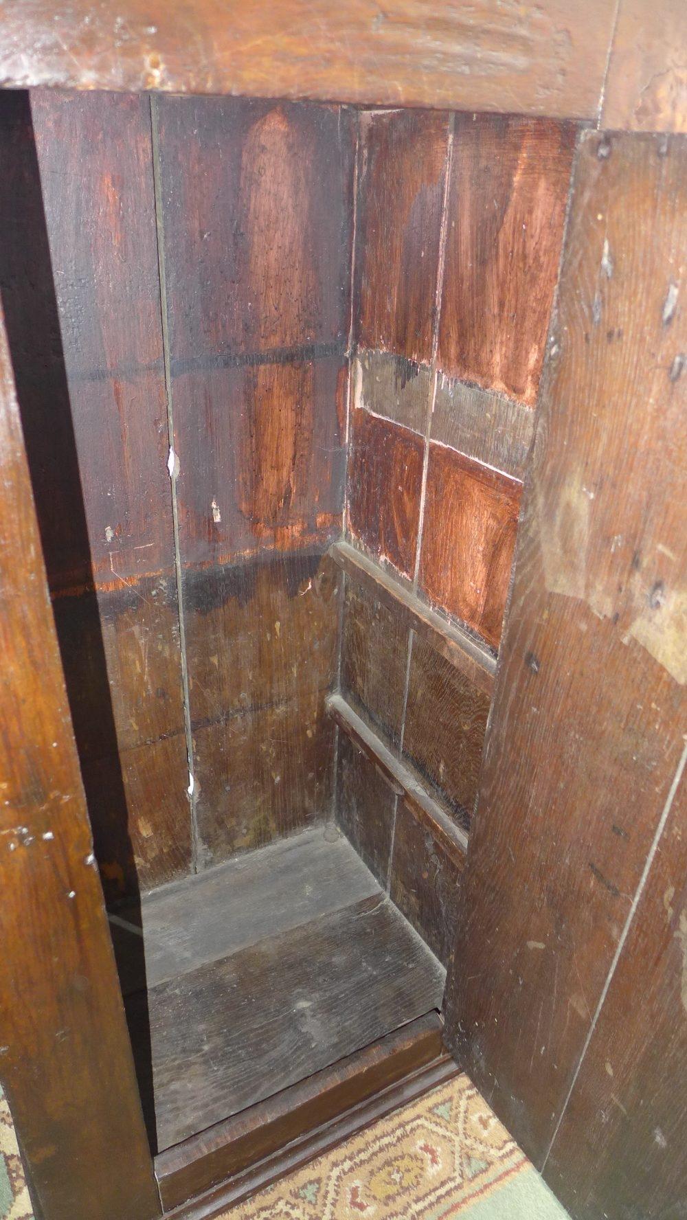 A 17th century oak hall cupboard, with carved lozenge panel door having cast iron hinges, raised - Image 2 of 3