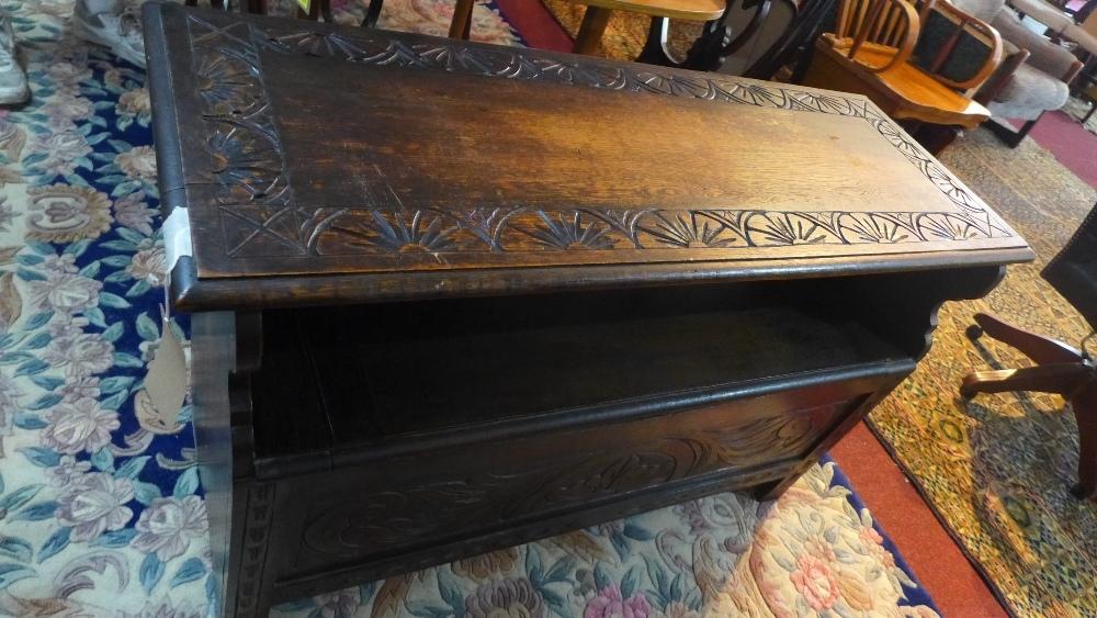 An early 20th century carved oak bench with folding back - Image 2 of 2