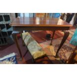 A 20th century mahogany centre table, raised on cabriole legs, H.77 W.91 D.55cm
