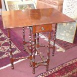 A late 19th century mahogany drop leaf table with barley twist legs, H.70cm D.60cm