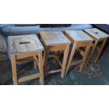 A set of four 20th century beechwood stools