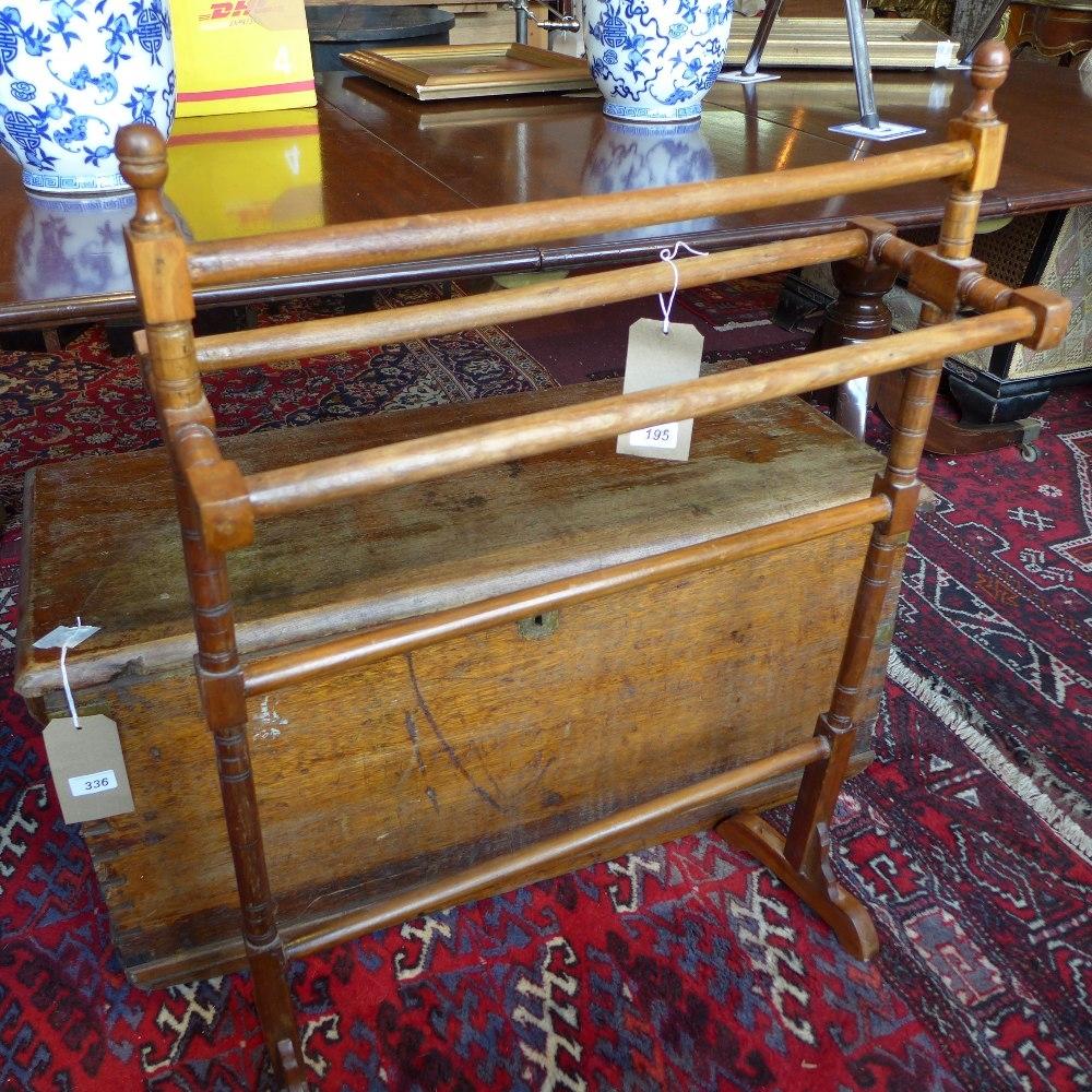 An early 20th century mahogany towel rail